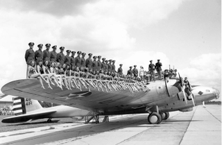 A publicity shot showing just how many dancing girls and their dates can fit on the wing of the XB-15 (US Air Force)
